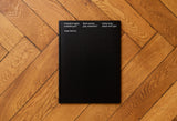 Front cover image of publication 'Black jacket, gray sweatshirt' on a brown background.
