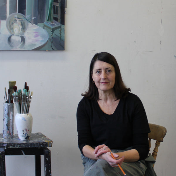 The artist Mairead O'hEocha sits in her studio