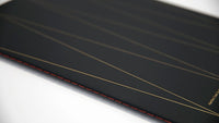 Image of close up of spine of "Hairline Crack (a dialogue)" on a white background.